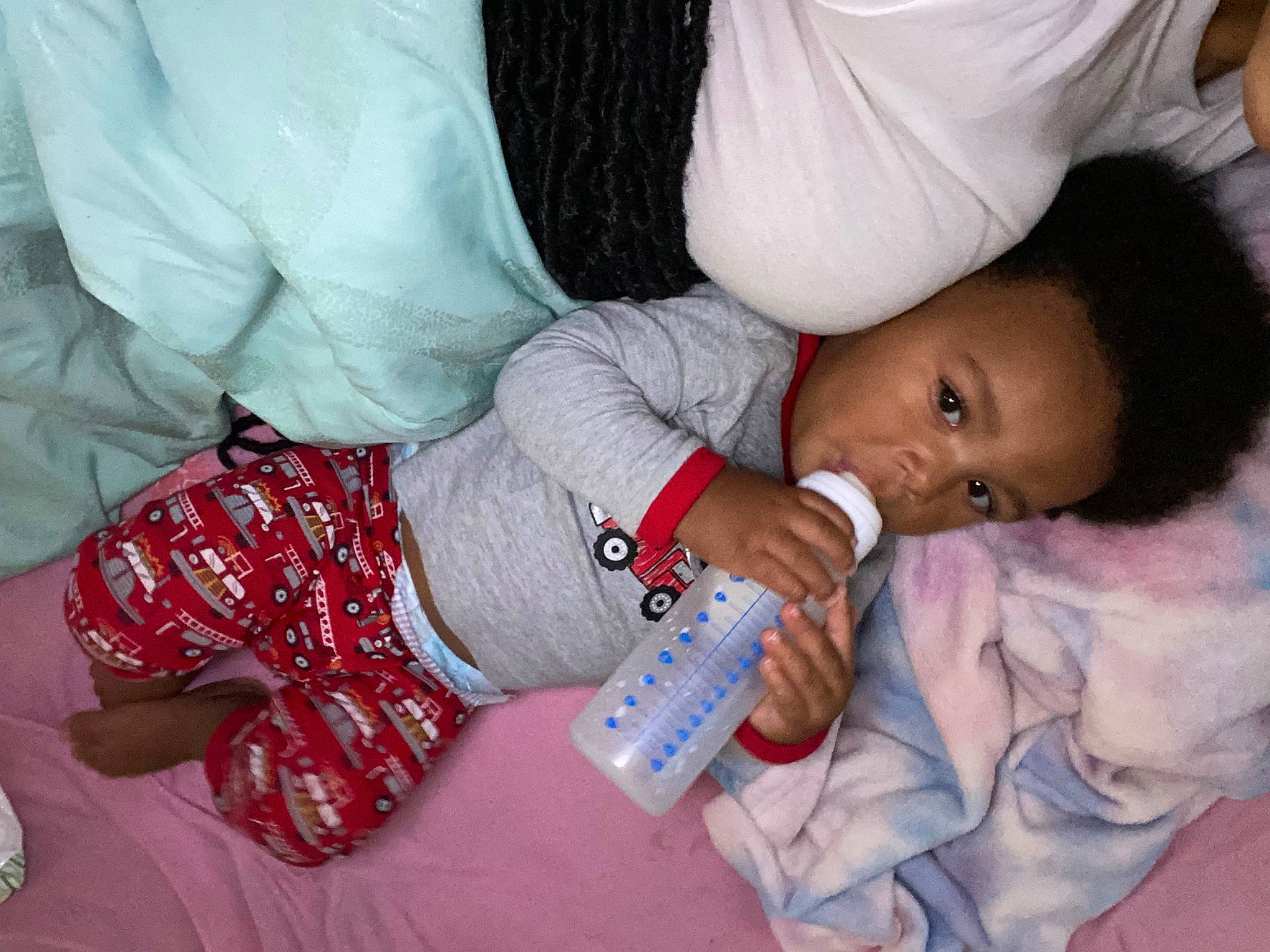 Fortune is registered to the contest to win money with this photo: baby, baby_products, baby_toddler_clothing, bottle, cheek, child, comfort, finger, gesture, happy, mouth, nail, nap, nose, person, room, sitting, skin, sleeve, toddler