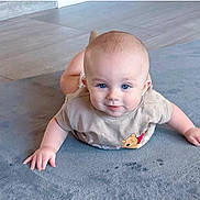 Ethan joined the competition — help win amazing prizes! baby, child, tummy_time, blue_eyes, winnie_the_pooh, shirt, rug, floor, indoor, cute, smile, infant, person, skin, head, hands, playful, expression, light, homedecor