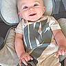 Ethan joined the competition — help win amazing prizes! baby, infant, smile, blue_eyes, nike, logo, clothing, cushion, seat, happy, cute, portrait, child, human, skin, head, hand, apparel, indoor, relaxing