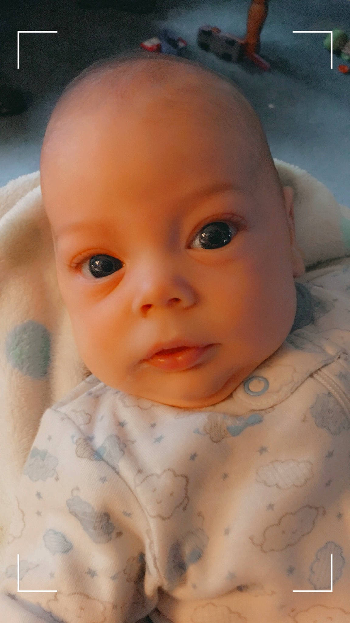 Remingtyn is registered to the contest to win money with this photo: baby, baby_toddler_clothing, cheek, chest, child, chin, close_up, collar, eye, eyebrow, eyelash, forehead, iris, lip, mouth, nose, pattern, person, skin, sleeve