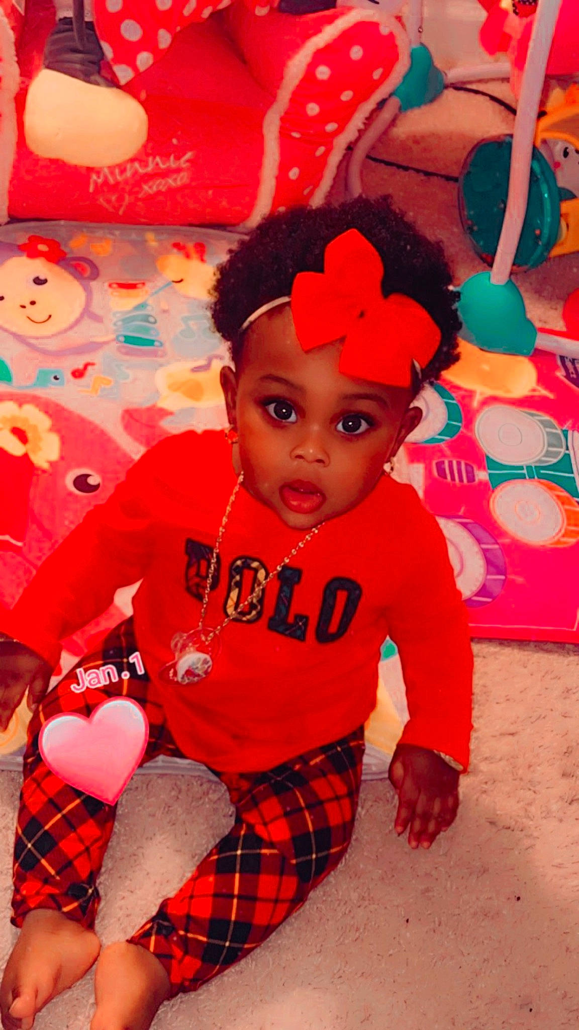 Kaniaya is registered to the contest to win money with this photo: baby, baby_toddler_clothing, cap, carmine, child, fun, happy, hat, headwear, magenta, orange, pattern, person, pink, plaid, red, sitting, sleeve, sock, surprise