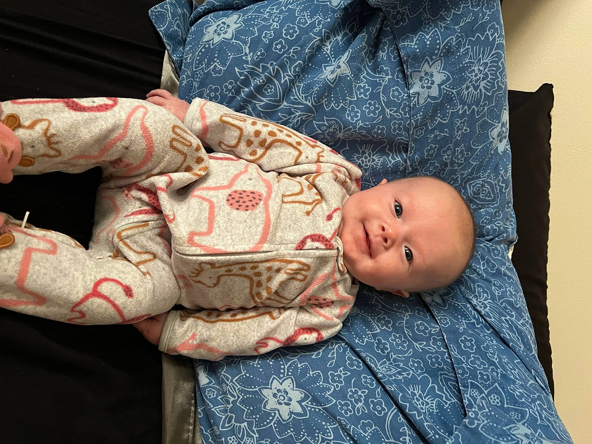 Braylynn is registered to the contest to win money with this photo: arm, baby, baby_products, baby_toddler_clothing, carmine, cheek, child, comfort, elbow, flash_photography, hand, human_body, linens, pattern, person, room, sitting, skin, sleeve, smile
