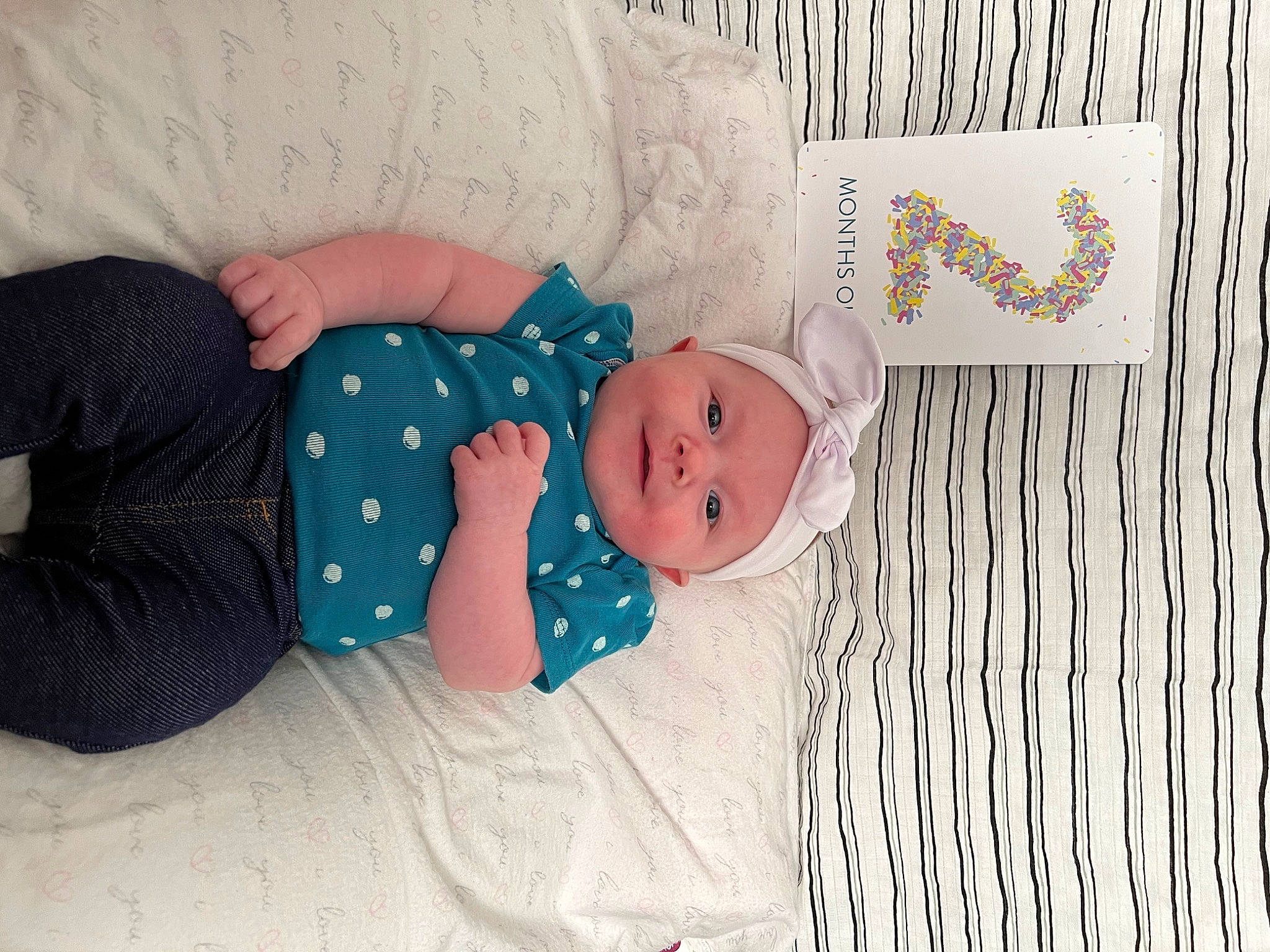 Braylynn is registered to the contest to win money with this photo: baby, baby_products, baby_sleeping, baby_toddler_clothing, bed, bedding, bedtime, child, comfort, linens, mammal, nap, pattern, person, room, sitting, sleeve, sock, toddler, wood