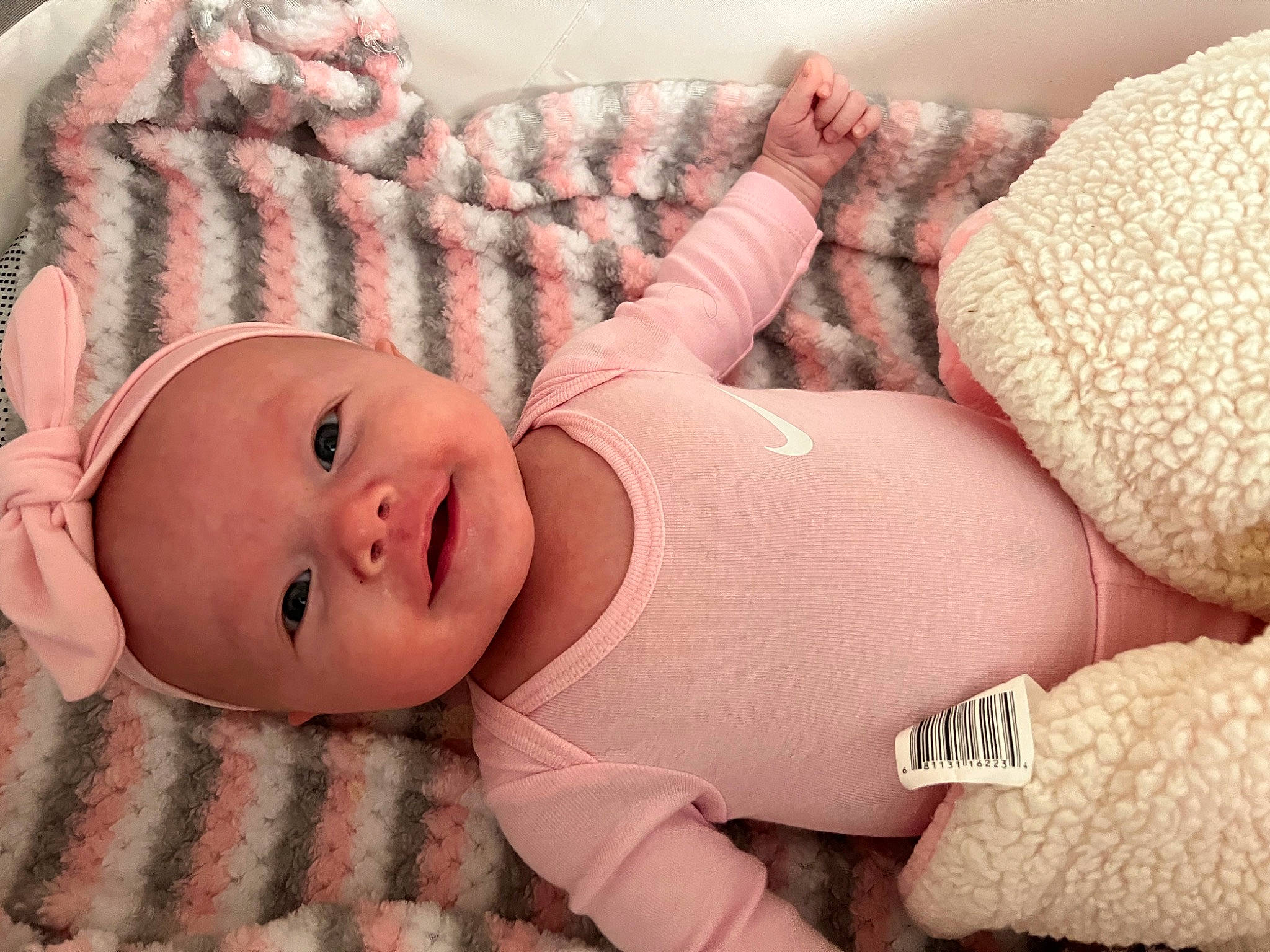 Braylynn is registered to the contest to win money with this photo: arm, baby, baby_toddler_clothing, cheek, comfort, eye, face, finger, hand, head, headgear, human_body, leg, lip, mouth, muscle, person, pink, skin, stomach