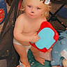 Haisleigh is registered to the contest to win money with this photo: abdomen, baby, baby_toddler_clothing, barechested, chair, cheek, chest, child, diaper, eye, foot, fun, happy, human_leg, mouth, sitting, skin, thigh, toddler, trunk
