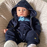 Ezekyel participe au concours pour gagner de l'argent avec cette photo : baby, child, hoodie, navy_blue, pants, white_sneakers, blanket, soft_texture, indoor, curious, wide_eyes, seated, casual_clothing, infant, cute, portrait, comfortable, fashion, young_child, apparel