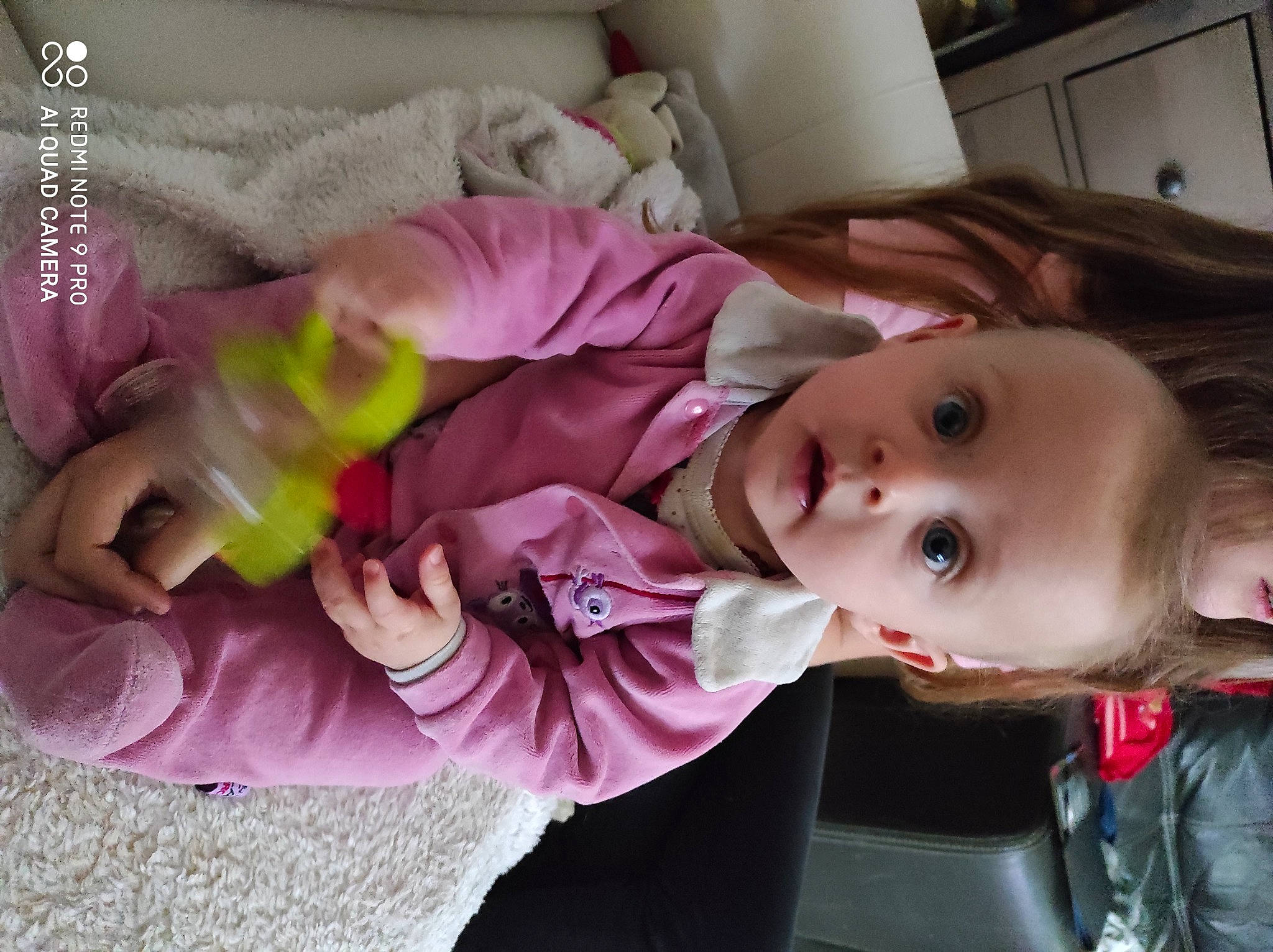 Kaissy participe au concours pour gagner de l'argent avec cette photo : baby, baby_products, baby_toddler_clothing, cheek, child, comfort, fun, lamp, magenta, person, pink, product, purple, room, sitting, skin, surprise, toddler