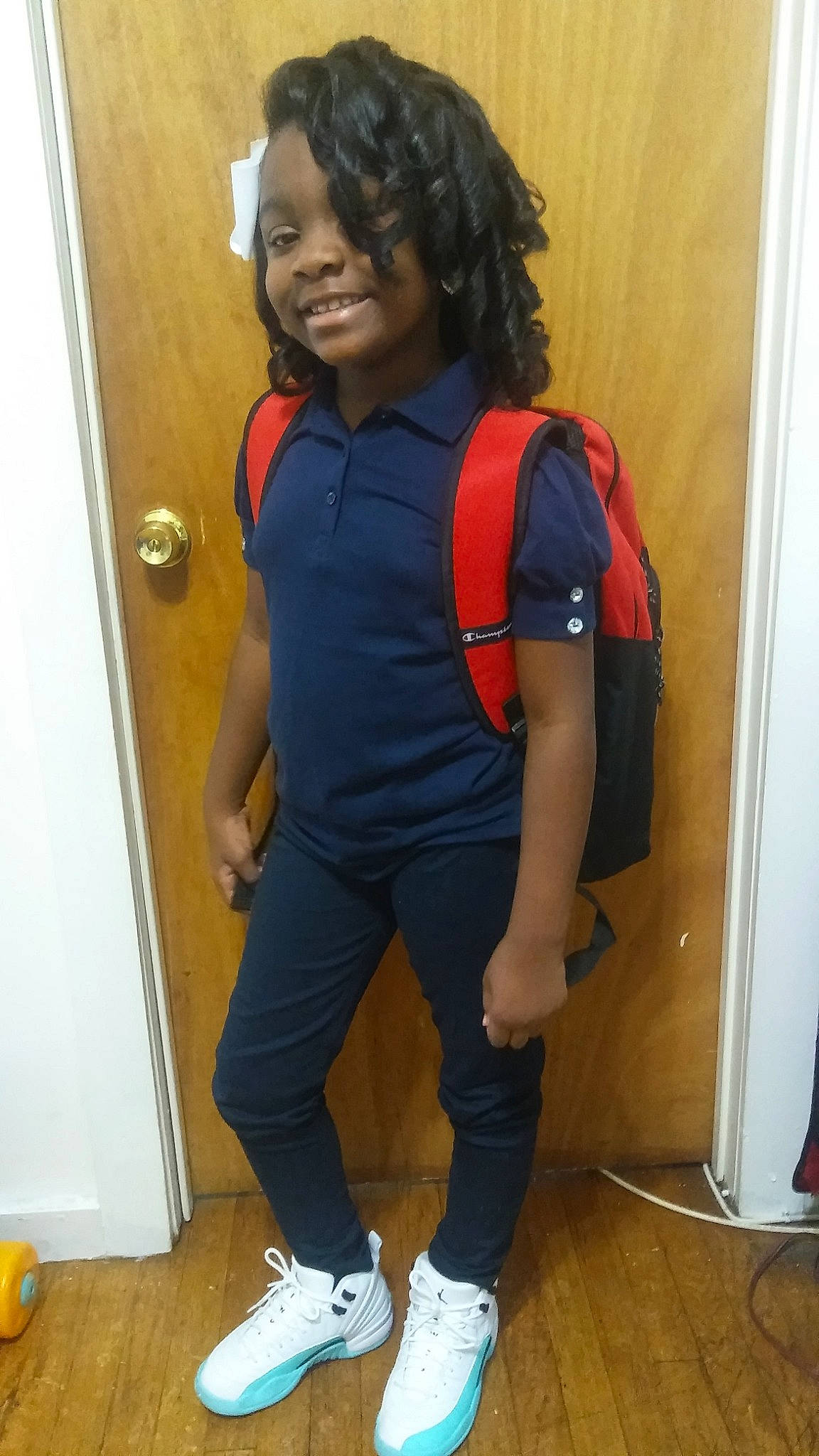 Zion is registered to the contest to win money with this photo: abdomen, arm, blue, cool, footwear, fun, girl, hair, hairstyle, jeans, joint, leg, outerwear, person, product, shoe, shoulder, standing, t_shirt, textile