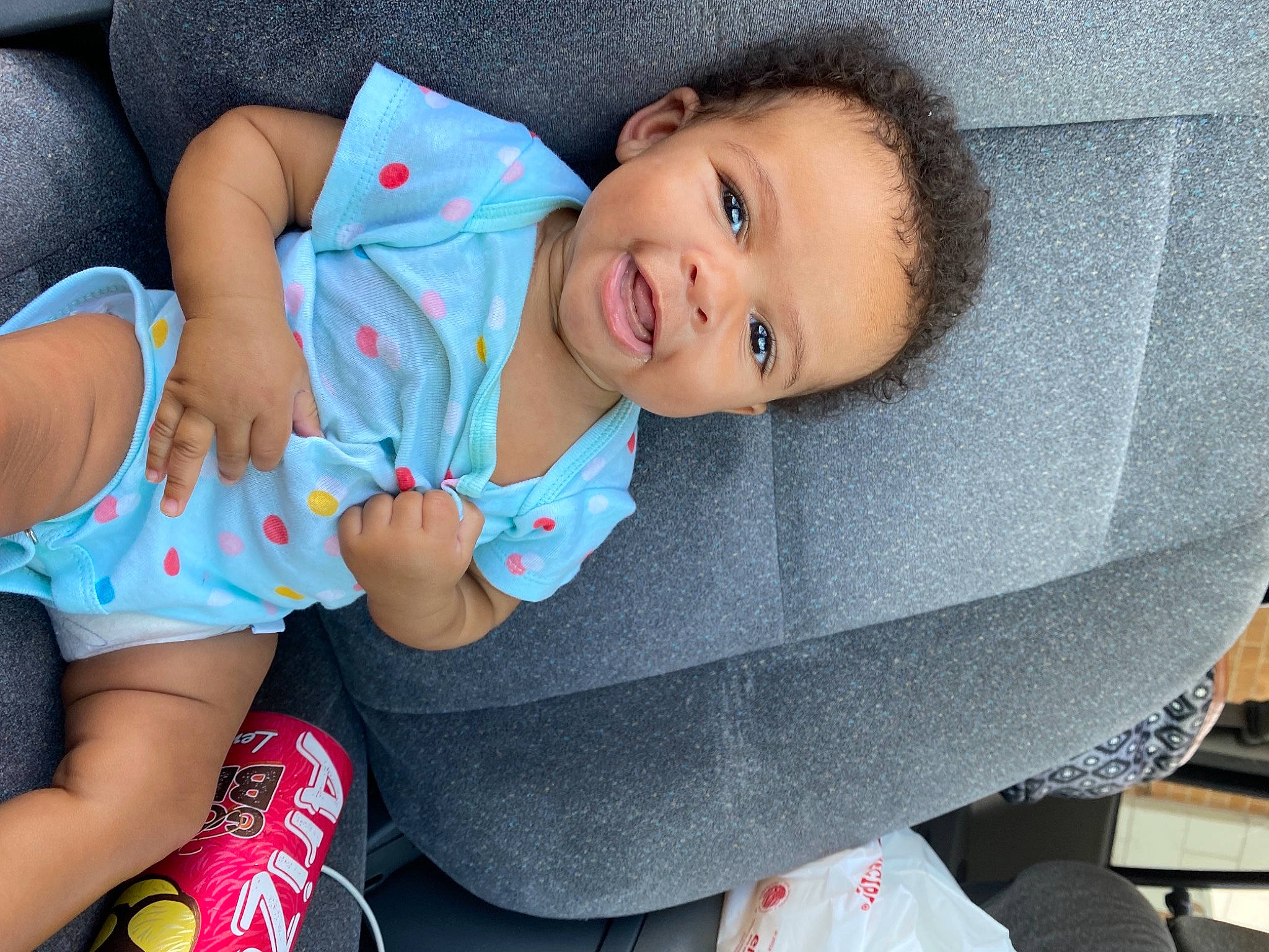 Akeelah joined the competition — help win amazing prizes! baby, baby_toddler_clothing, blue, child, comfort, dress, face, finger, happy, head, person, pink, product, skin, sleeve, smile, sock, textile, thigh, toddler