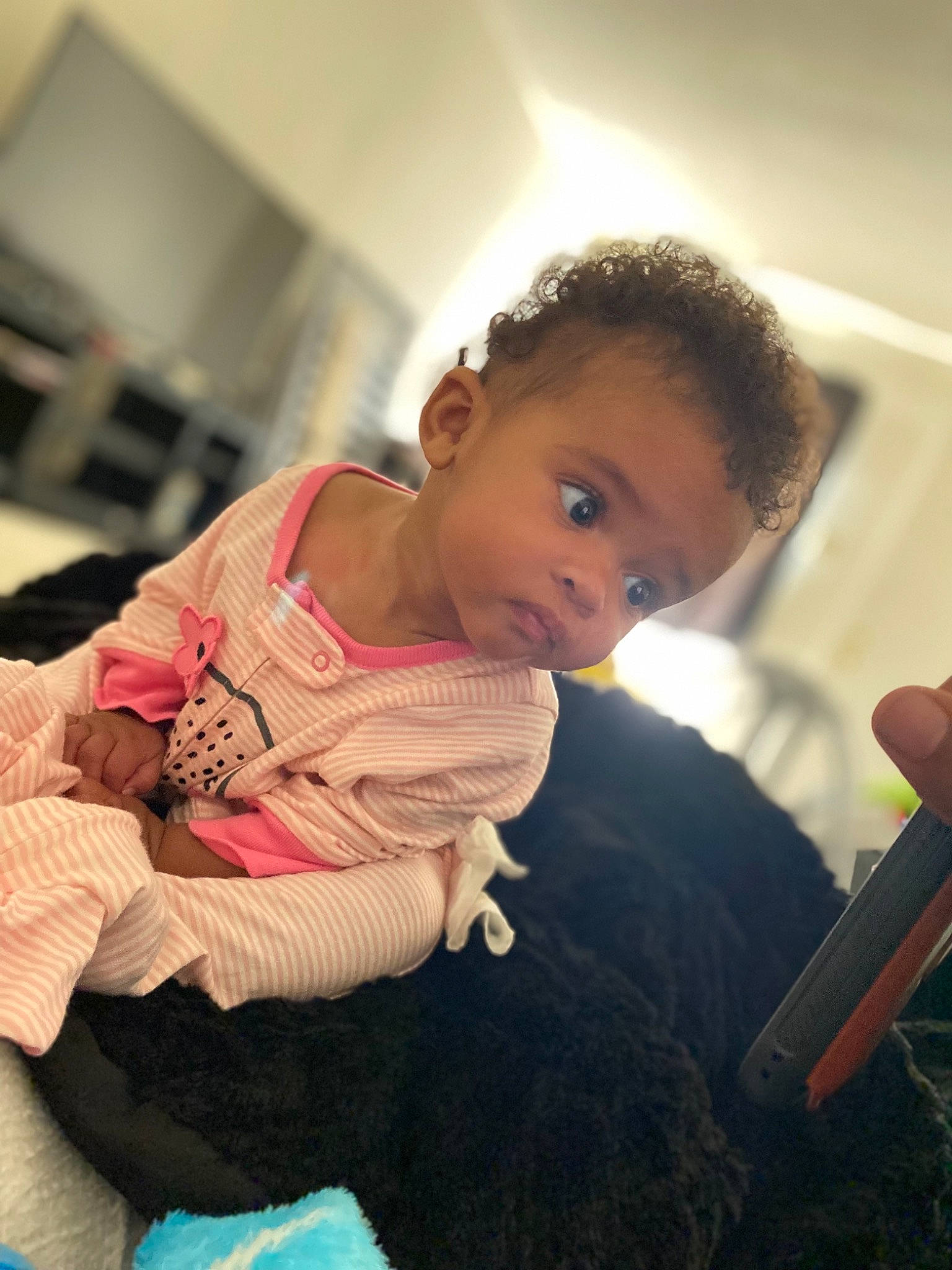 Akeelah joined the competition — help win amazing prizes! baby, baby_toddler_clothing, cheek, child, comfort, face, finger, flooring, fun, hand, happy, head, human_body, mouth, nose, person, room, sitting, skin, thumb