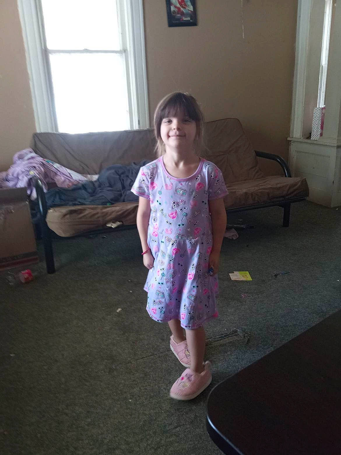 Isabella joined the competition — help win amazing prizes! child, comfort, couch, curtain, floor, flooring, fun, hardwood, human_leg, joy, knee, leisure, living_room, magenta, person, picture_frame, room, sandal, sitting, smile