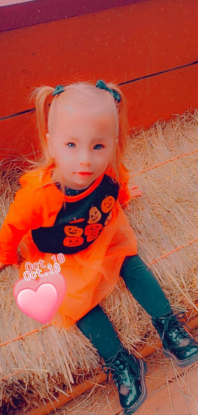 Giana joined the competition — help win amazing prizes! baby, baby_toddler_clothing, blond, child, face, fun, grass, hairstyle, happy, iris, nose, orange, outerwear, peach, people_in_nature, person, pink, sitting, skin, sleeve