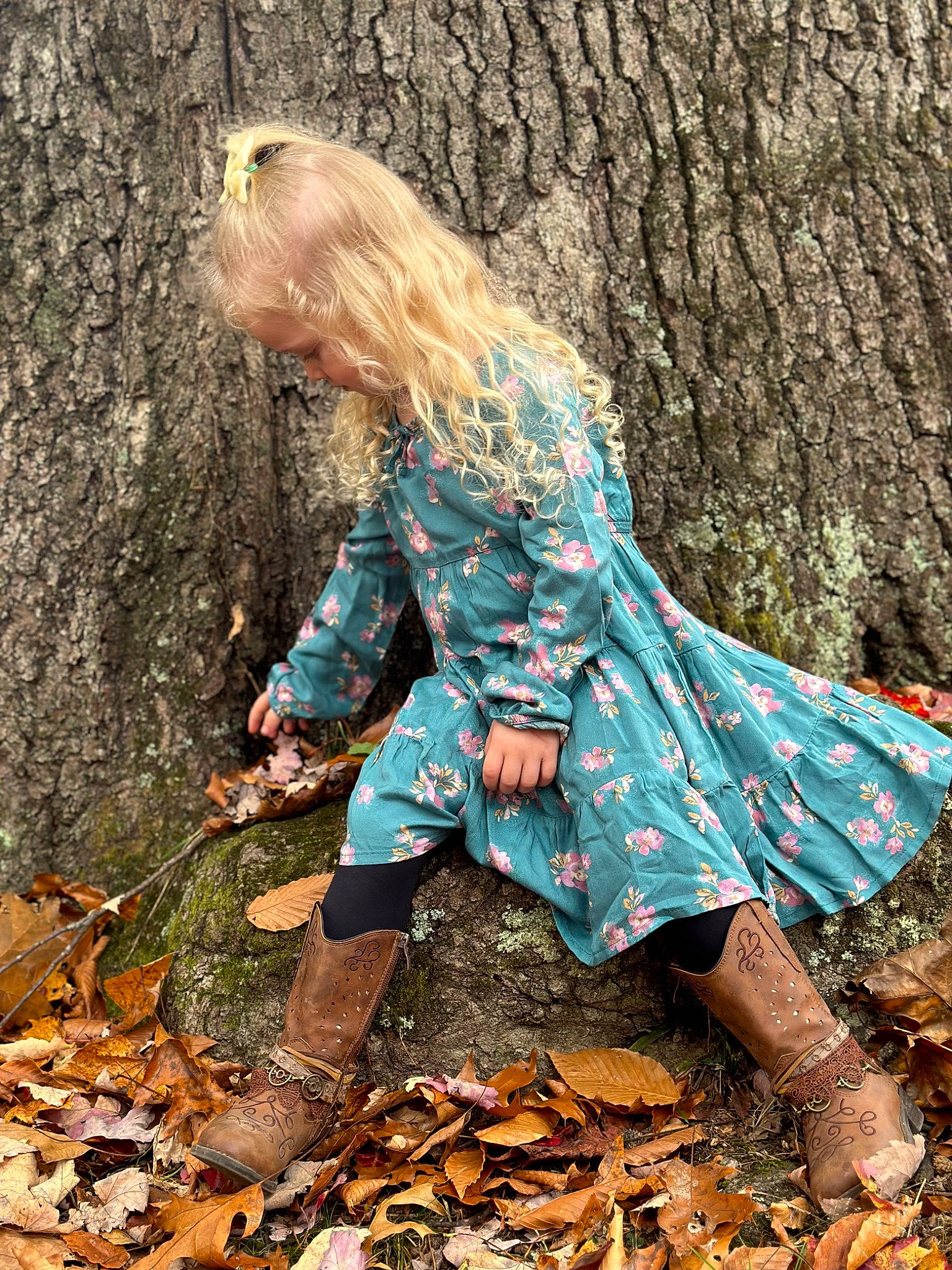 Paislynn joined the competition — help win amazing prizes! boot, branch, deciduous, fawn, footwear, forest, grass, human_body, human_leg, leaf, leg, long_hair, people_in_nature, person, plant, sneakers, thigh, tree, trunk, wood