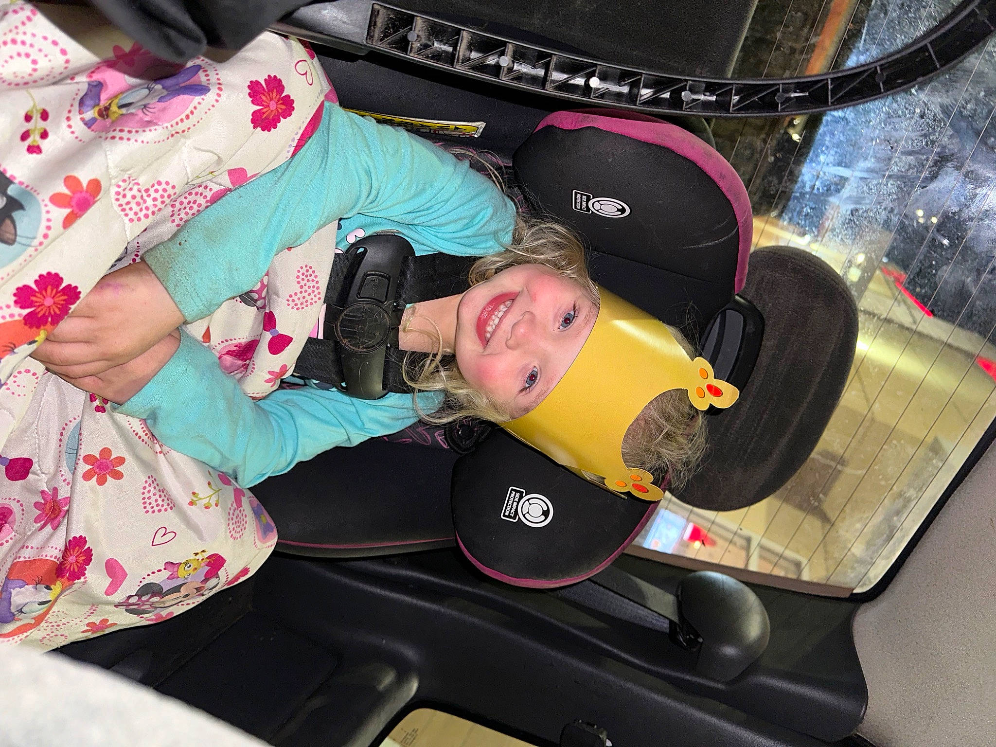 Paislynn is registered to the contest to win money with this photo: audio_equipment, auto_part, automotive_design, automotive_tire, automotive_wheel_system, baby_products, baby_toddler_clothing, car_seat, child, fun, hat, headwear, joy, pattern, person, sleeve, smile, steering_wheel, toddler