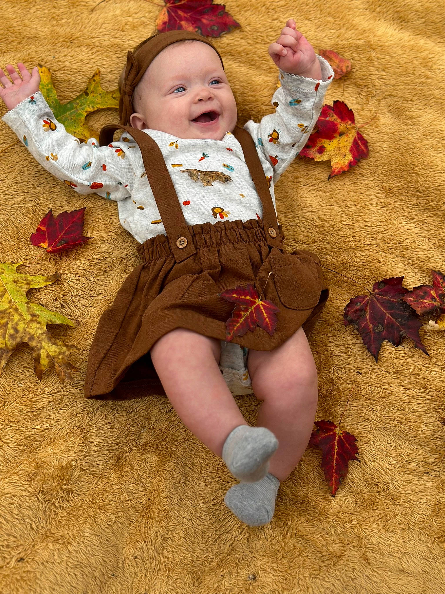 Malia joined the competition — help win amazing prizes! baby, baby_toddler_clothing, child, eye, face, fawn, foot, fun, grass, happy, hat, human_body, human_leg, leg, people_in_nature, person, plant, sitting, skin, smile