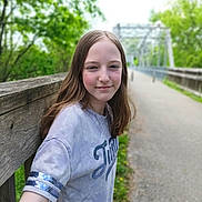 Isabella is registered to the contest to win money with this photo: accessories, child, clothing, face, female, girl, happy, head, longsleeve, outdoors, path, person, photography, plant, portrait, road, sleeve, smile, t_shirt, vegetation