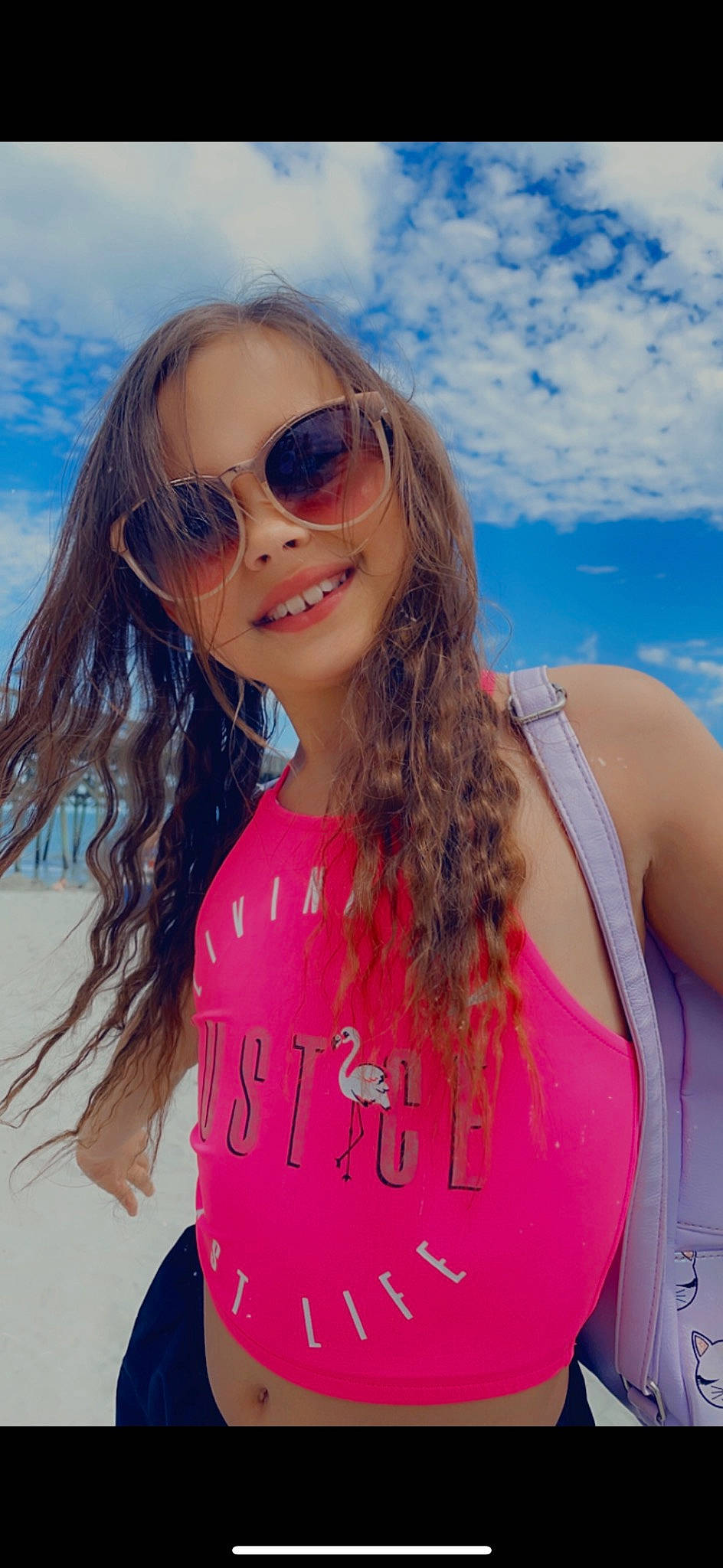 Emma Kate is registered to the contest to win money with this photo: black_hair, body_of_water, chin, cloud, cool, eyewear, fun, glasses, goggles, hair, happy, head, joy, lip, long_hair, person, sky, sleeve, smile, sunglasses