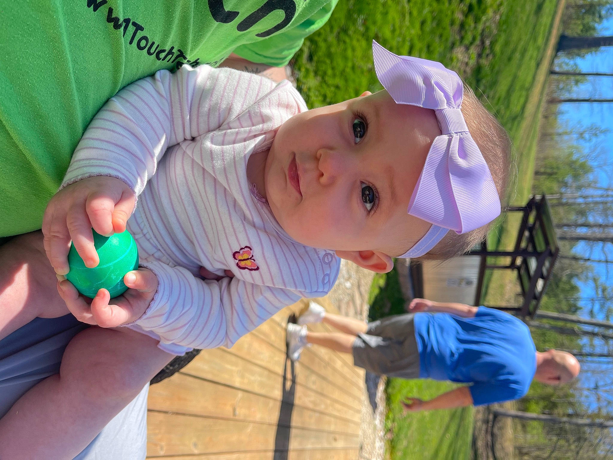 Calliope joined the competition — help win amazing prizes! baby, baby_products, baby_toddler_clothing, child, facial_expression, fun, grass, green, happy, hat, headwear, leisure, person, plant, play, recreation, sky, sun_hat, toddler, toy