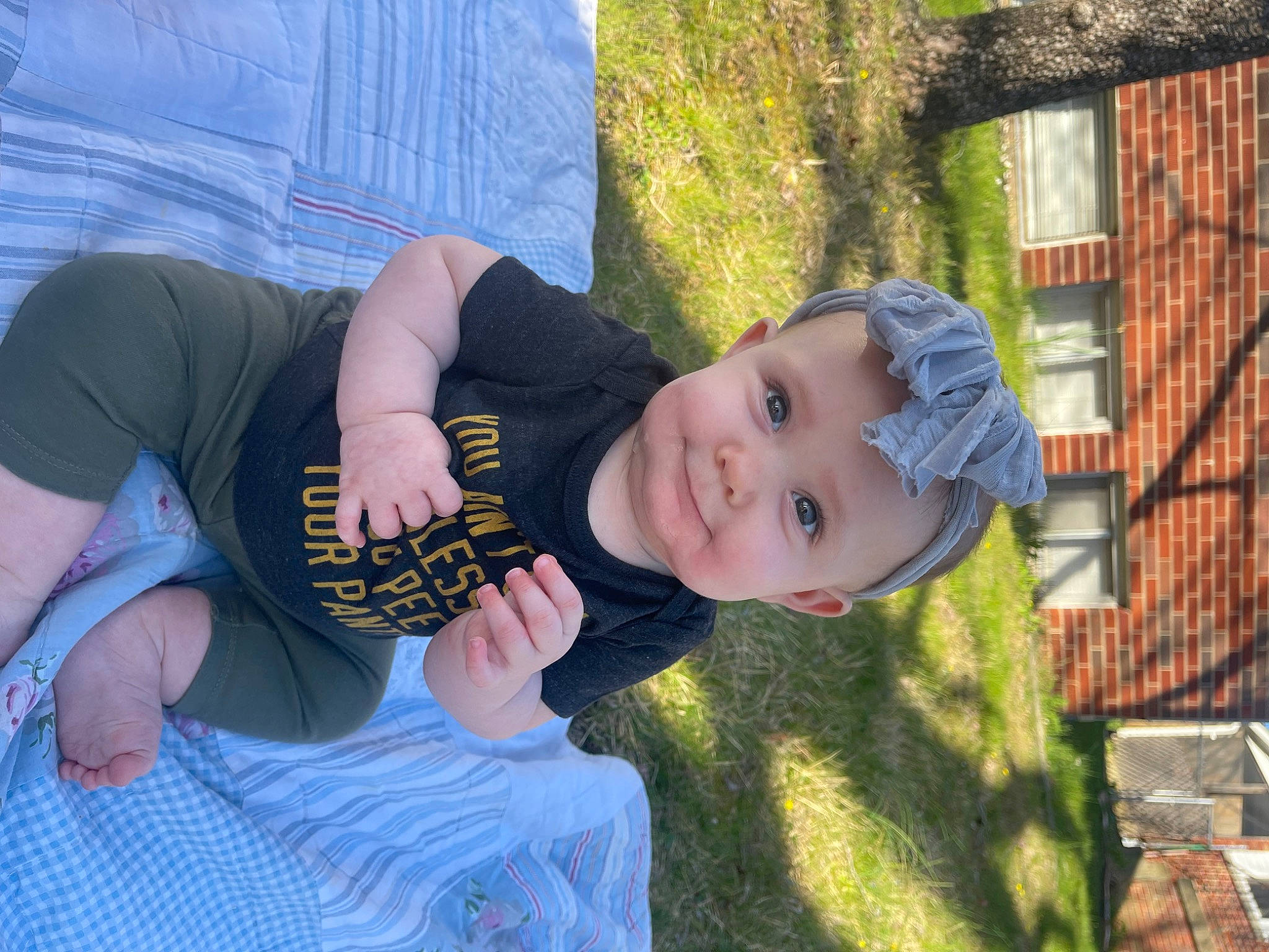 Calliope joined the competition — help win amazing prizes! baby, baby_toddler_clothing, child, elbow, fun, grass, happy, headwear, knee, lawn, leisure, person, plant, play, recreation, sitting, smile, t_shirt, thigh, toddler