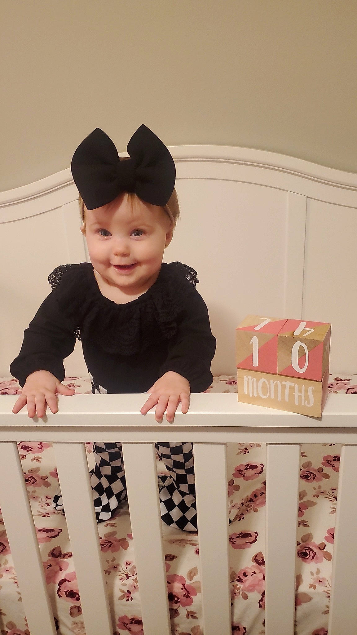 Madilynn is registered to the contest to win money with this photo: baby, baby_toddler_clothing, cap, child, design, face, font, fun, happy, headwear, indoor_games_and_sports, joy, pattern, person, pink, play, product, room, sleeve, smile