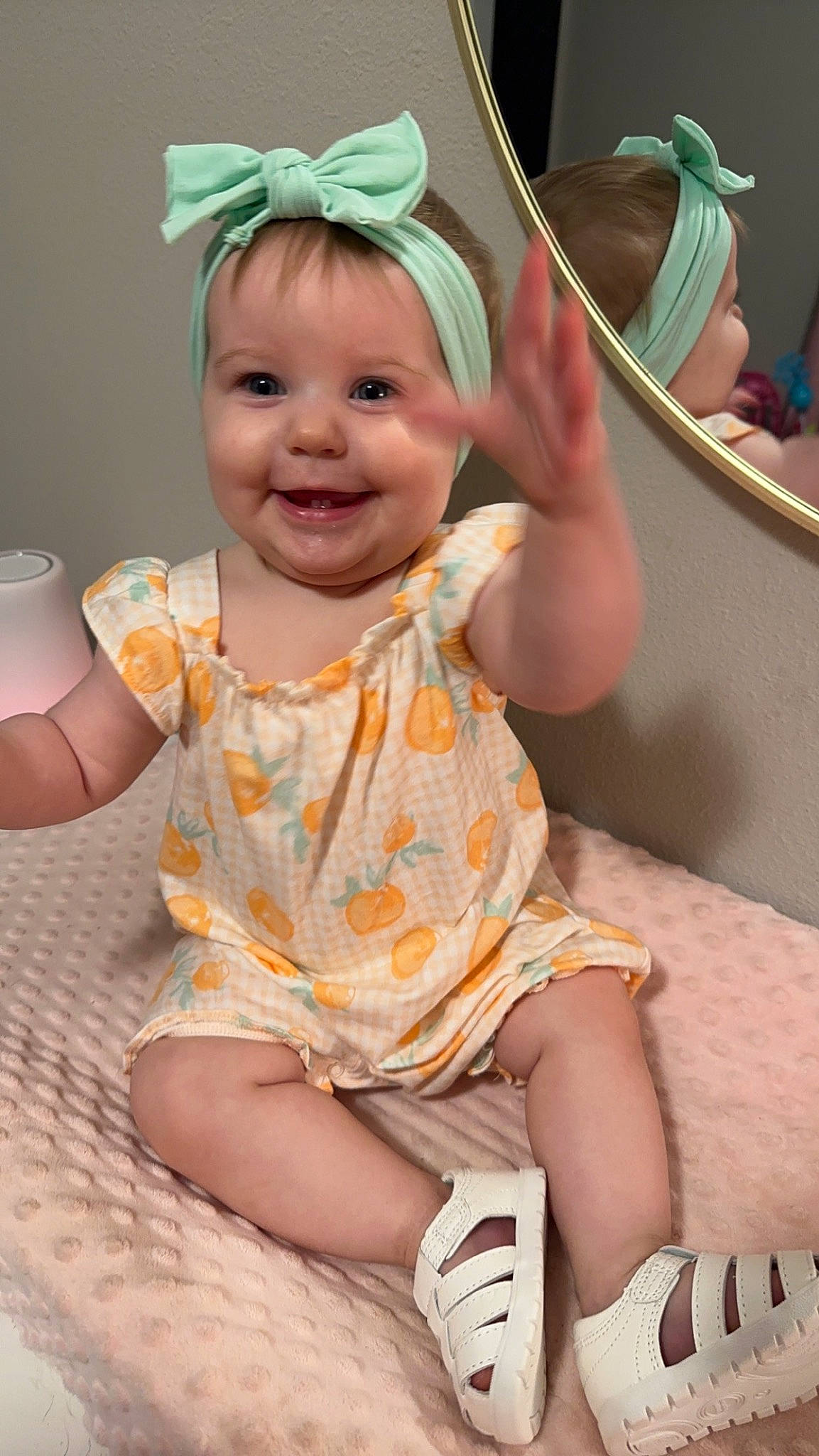 Madilynn is registered to the contest to win money with this photo: baby, baby_toddler_clothing, cheek, child, dress, fashion_accessory, fun, green, hairstyle, happy, head, headband, headgear, headpiece, headwear, joy, paper_towel, person, pink, purple