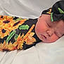 newborn, baby, sleeping, headband, bow, sunflower, blanket, pattern, flower, infant, face, skin, cute, resting, soft, white, fabric, closeup, peaceful, wrapped