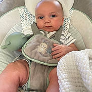 Kane joined the competition — help win amazing prizes! baby, baby_seat, blanket, blue_eyes, child, closeup, clothing, comfort, cushion, cute, expression, face, hand, indoors, infant, legs, person, portrait, soft_toy, toy