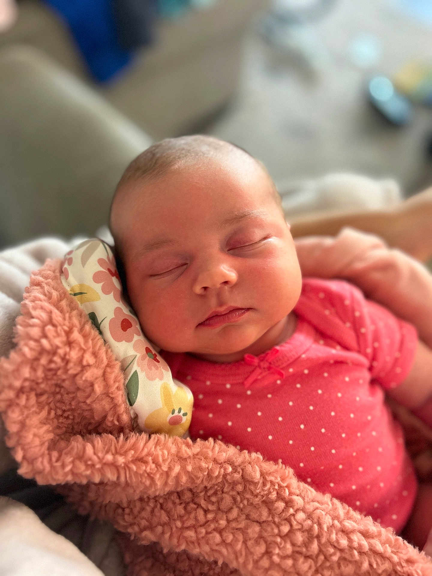 Ayla is registered to the contest to win money with this photo: baby, newborn, sleeping, blanket, pink, floral, pillow, soft, cute, peaceful, infant, face, clothing, closeup, portrait, indoors, person, relaxing, resting, cozy