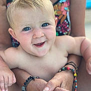Alba participe au concours pour gagner de l'argent avec cette photo : baby, child, blue_eyes, blond_hair, smiling, happy, person, arms, bracelets, skin, portrait, closeup, outdoor, summer, holding, colorful, background, face, cute, expression