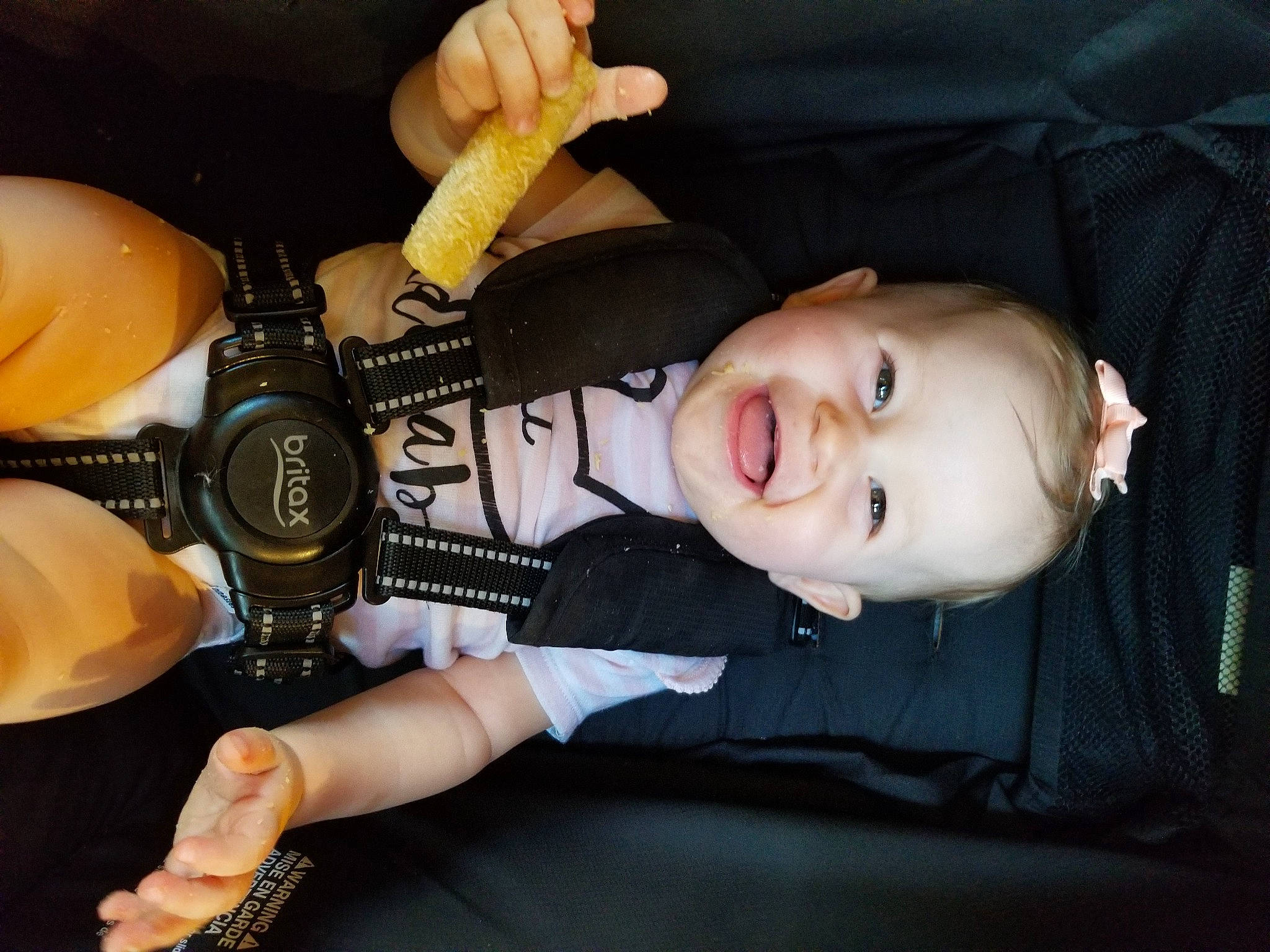 Scarlett is registered to the contest to win money with this photo: audio_equipment, auto_part, automotive_lighting, car_seat, cool, finger, flash_photography, fun, gesture, headgear, human_leg, knee, nail, person, personal_protective_equipment, skin, thigh, thumb, toddler, toy