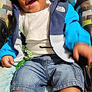 Jayden joined the competition — help win amazing prizes! toddler, baby_seat, smiling, child, jacket, denim_shorts, sneakers, happy, indoor, cushion, clothing, person, cute, infant, seat, footwear, blue, casual, young_child, playful