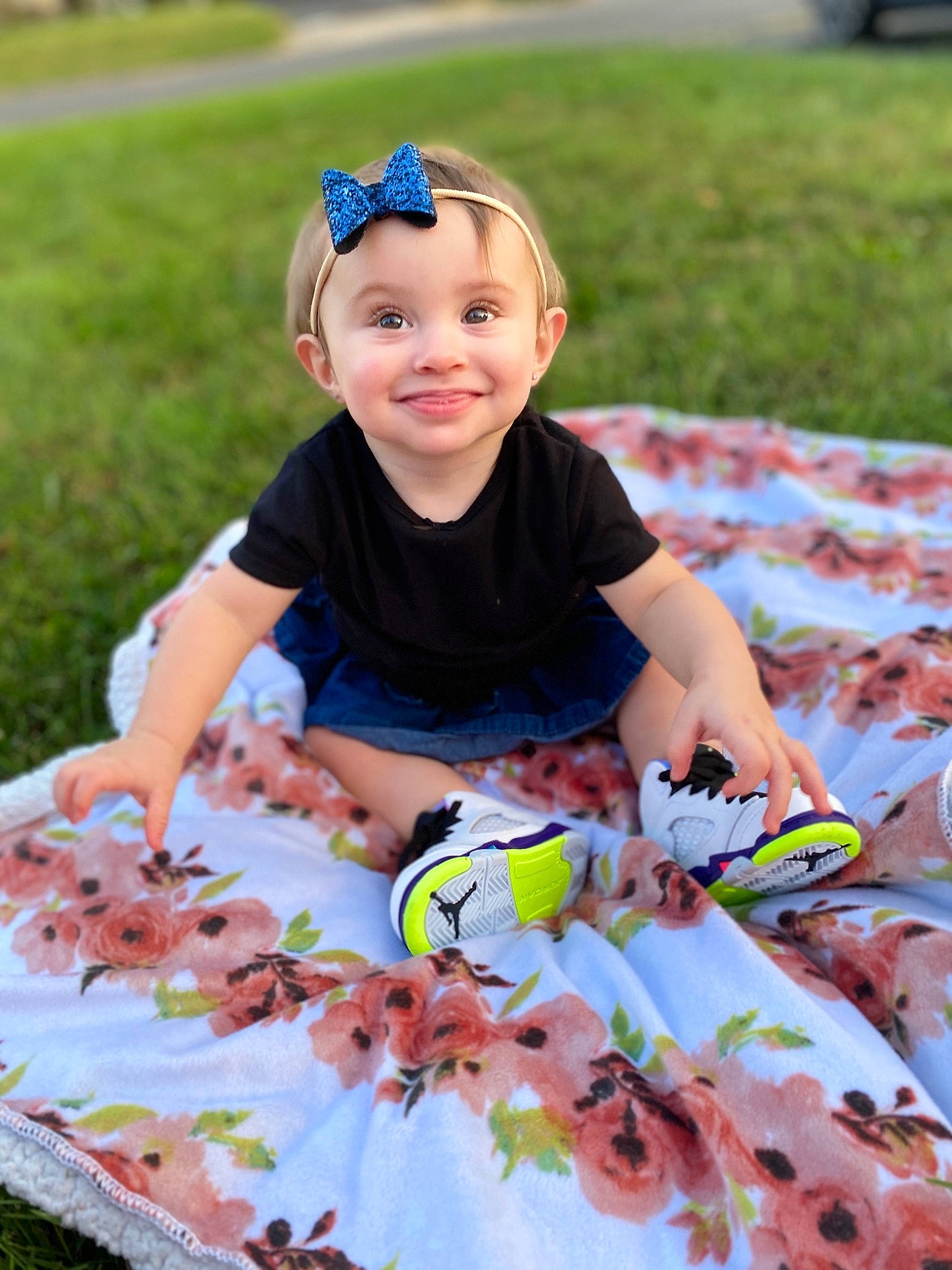 Hazel is registered to the contest to win money with this photo: baby, baby_products, baby_toddler_clothing, child, dress, fun, grass, hair_accessory, happy, headband, headwear, joy, leaf, pattern, person, photography, play, summer, toddler