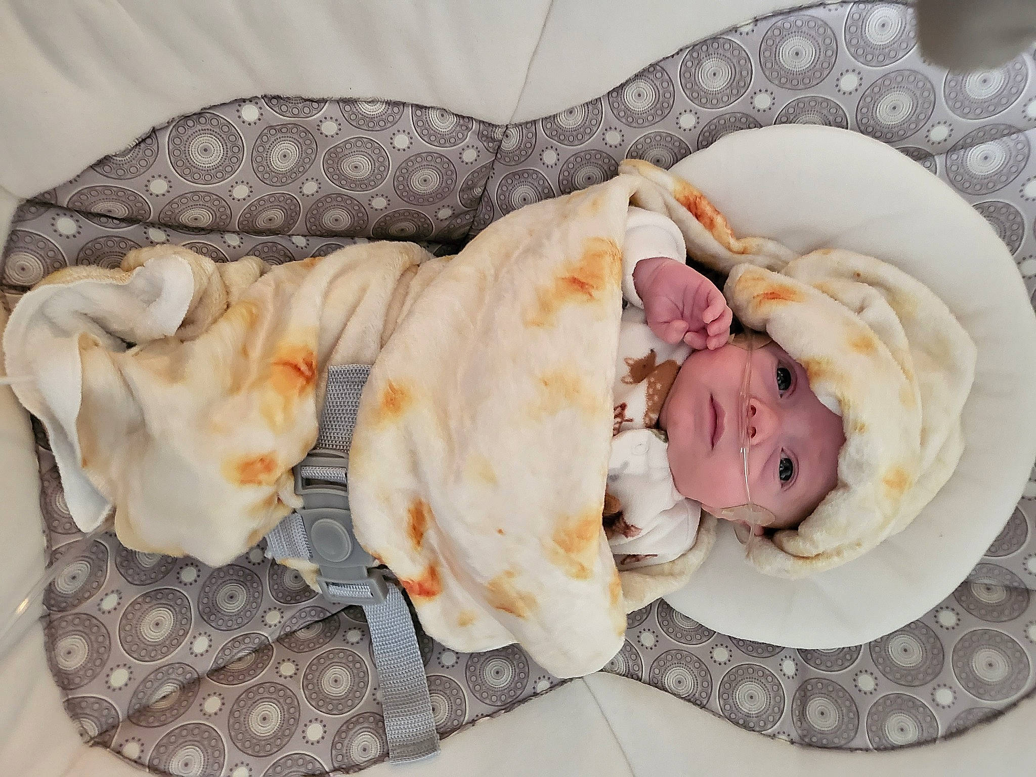 Liam is registered to the contest to win money with this photo: baby, baby_sleeping, baby_toddler_clothing, bedding, child, comfort, fashion_accessory, fur, hair_accessory, headband, headgear, headpiece, headwear, jewellery, linens, nap, peach, person, petal, rose