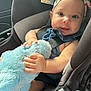 Aria joined the competition — help win amazing prizes! baby, car_seat, stuffed_animal, plush_toy, child, headband, blue, smiling, indoor, seat_belt, infant, cute, person, sitting, soft_toy, car_interior, clothing, portrait, happy, closeup