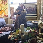Miki joined the competition — help win amazing prizes! ball, basket, cat, cat_tree, coffee_table, container, couch, curtain, decor, furniture, indoor, lamp, living_room, painting, pillow, plant, rug, shelf, window, woman
