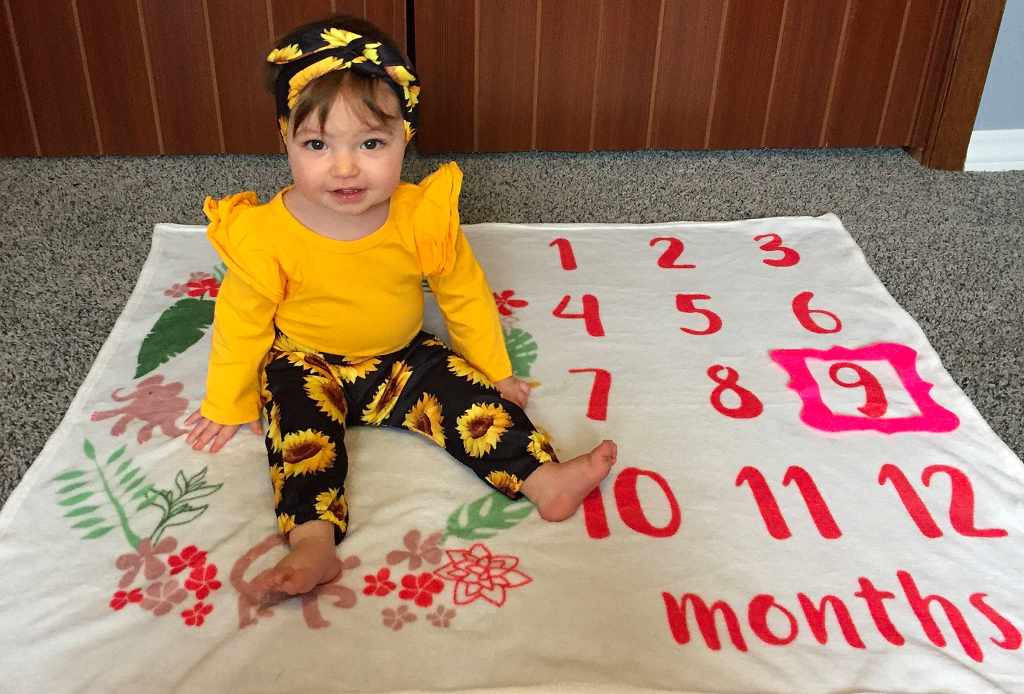 Elara joined the competition — help win amazing prizes! baby, baby_products, baby_toddler_clothing, blanket, carpet, child, floor, flooring, linens, nap_mat, pajamas, pattern, person, play, sleeve, textile, toddler, yellow
