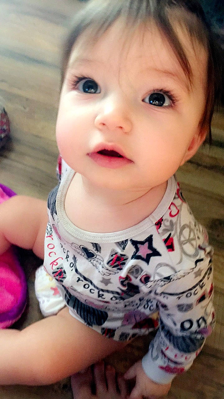 Elara joined the competition — help win amazing prizes! baby, beauty, brown_hair, cheek, child, child_model, chin, eye, eyebrow, face, forehead, hair, head, lip, mouth, nose, person, pink, skin, smile