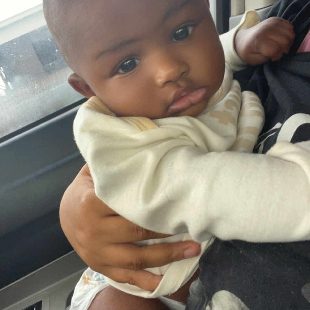 Bubbie joined the competition — help win amazing prizes! accessories, baby, belt, bodypart, clothing, cushion, face, finger, hand, happy, head, homedecor, newborn, person, photography, portrait, sitting, smile, transportation, vehicle