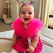 Athena participe au concours pour gagner de l'argent avec cette photo : baby, carpet, child, curtains, cute, floor, furniture, hair_ties, happy, indoors, pacifier, pigtails, pink_dress, playful, radiator, sitting, smiling, soft_lighting, tights, toy