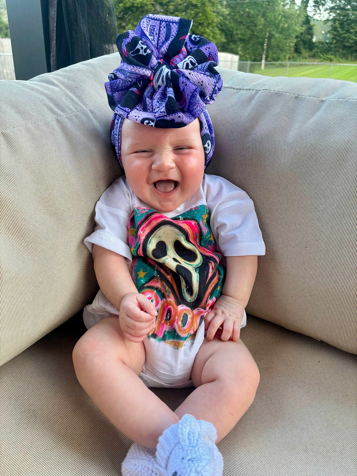 Ellie joined the competition — help win amazing prizes! baby, child, smiling, headwrap, tshirt, sitting, cushion, sofa, outdoor, grass, greenery, happy, infant, cute, person, footwear, knitted, portrait, relaxing, nature