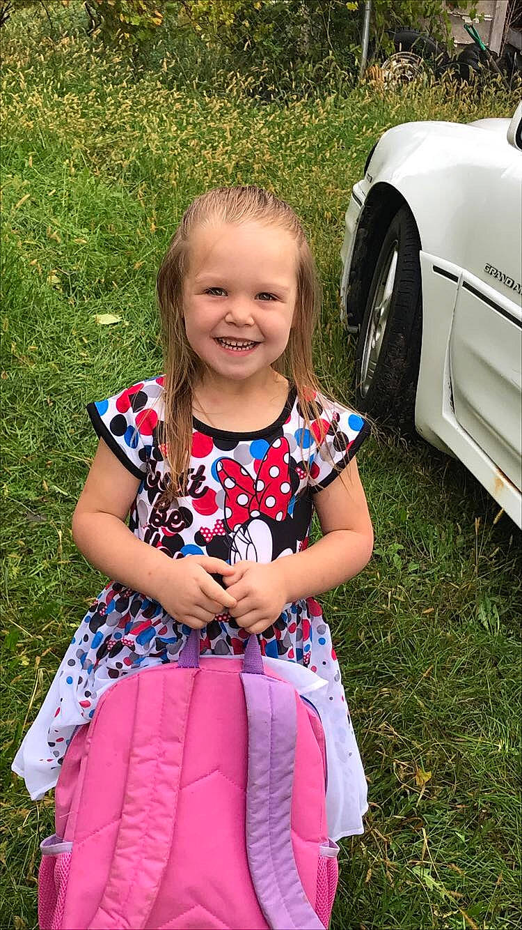 Holley is registered to the contest to win money with this photo: car, child, dress, family_car, fun, grass, joy, lawn, people, person, pink, plant, sitting, smile, summer, toddler, vacation, vehicle