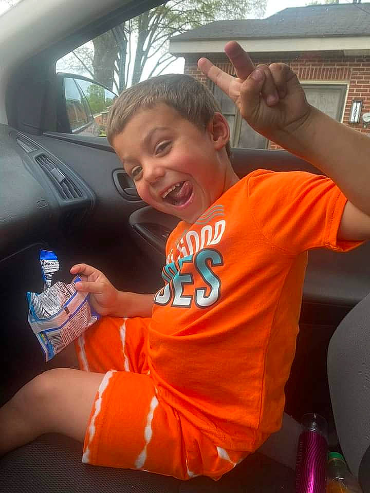 Kaeden joined the competition — help win amazing prizes! automotive_design, automotive_exterior, bottle, car, finger, fun, gesture, hand, happy, hood, leisure, motor_vehicle, muscle, person, plastic_bottle, smile, steering_wheel, t_shirt, thumb, vehicle_door