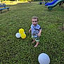 toddler, child, grass, balloons, playground, slide, bench, outdoor, sunlight, trees, greenery, summer, nature, barefoot, smiling, cute, casual_clothing, park, fun, daytime