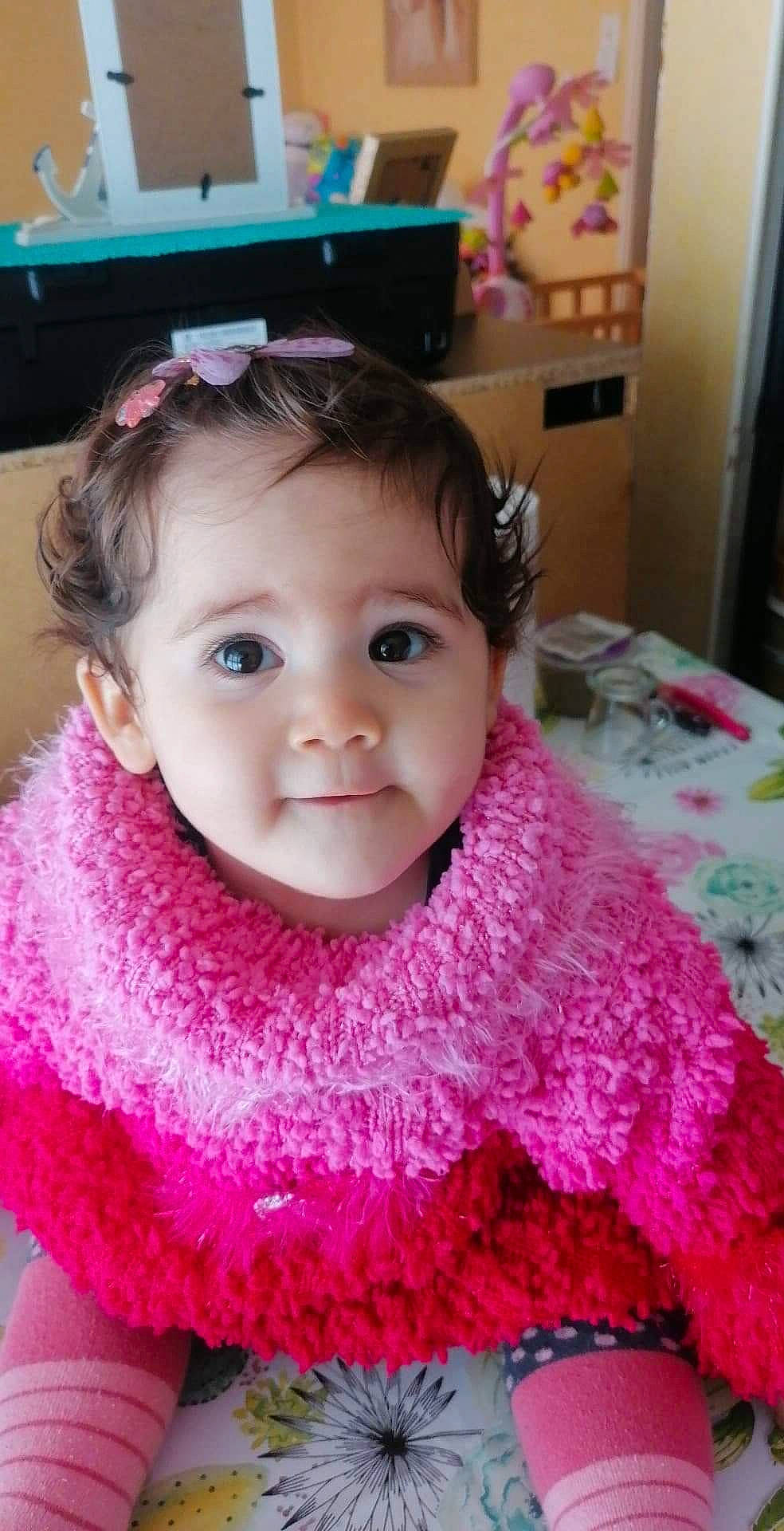 Janna participe au concours pour gagner de l'argent avec cette photo : baby_toddler_clothing, cheek, chin, ear, eye, eyebrow, eyelash, face, headgear, iris, lip, neck, nose, person, pink, product, purple, skin, sleeve, textile