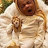 baby, infant, sleepy, yawning, portrait, bear_hat, onesie, blanket, stuffed_animal, lion_toy, nursery, cozy, sitting, lying_down, face, head, indoor, plants, warm_lighting, photography