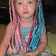Brooklyn is registered to the contest to win money with this photo: blanket, blue_eyes, blue_hair, braided_hair, child, clothing, colorful_hair, cute, face, hair_extensions, home, indoor, pacifier, person, pink_hair, portrait, serious_expression, sitting, toddler, young_child
