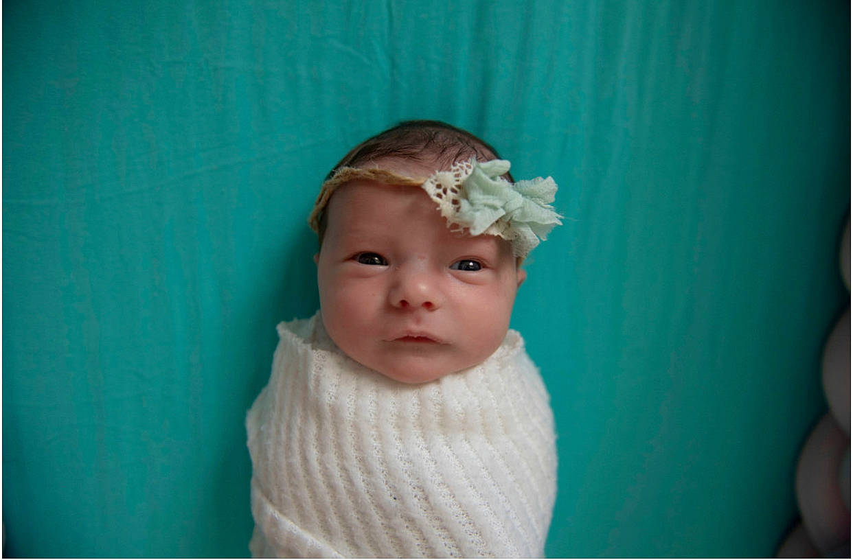 Jemma joined the competition — help win amazing prizes! baby, baby_toddler_clothing, bonnet, bridal_accessory, cheek, child, eyelash, fashion_accessory, flash_photography, hair_accessory, happy, headband, headgear, headpiece, headwear, iris, linens, person, petal, portrait_photography