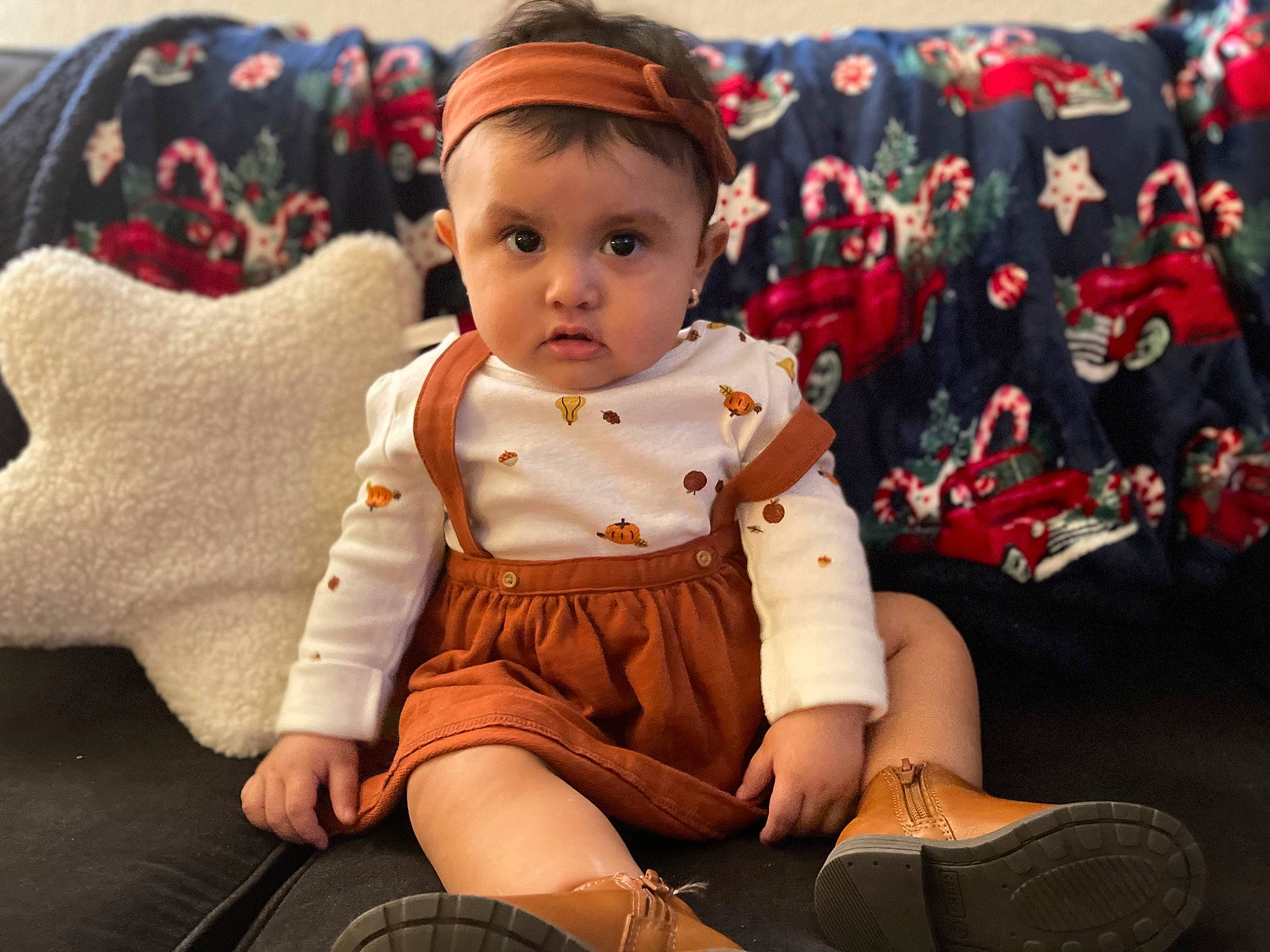 Addisyn is registered to the contest to win money with this photo: baby, baby_toddler_clothing, carmine, child, eye, fur, happy, head, holiday, human_leg, knee, lap, leg, person, shoe, sitting, skin, sleeve, sock, thigh
