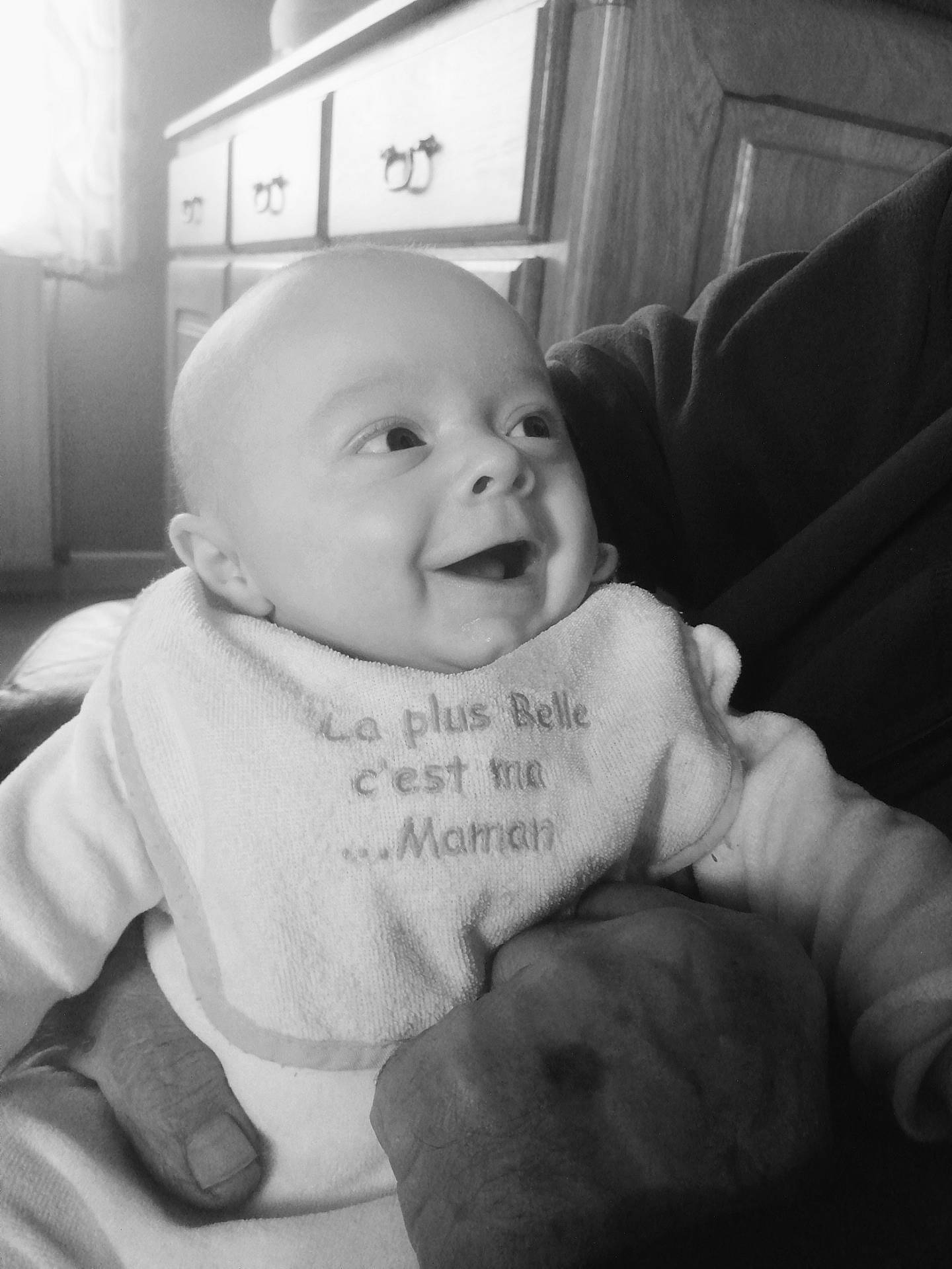 Aaron participe au concours pour gagner de l'argent avec cette photo : baby, black, black_and_white, cheek, comfort, cool, eye, facial_expression, finger, gesture, happy, iris, mouth, nose, person, skin, smile, standing, style, toddler