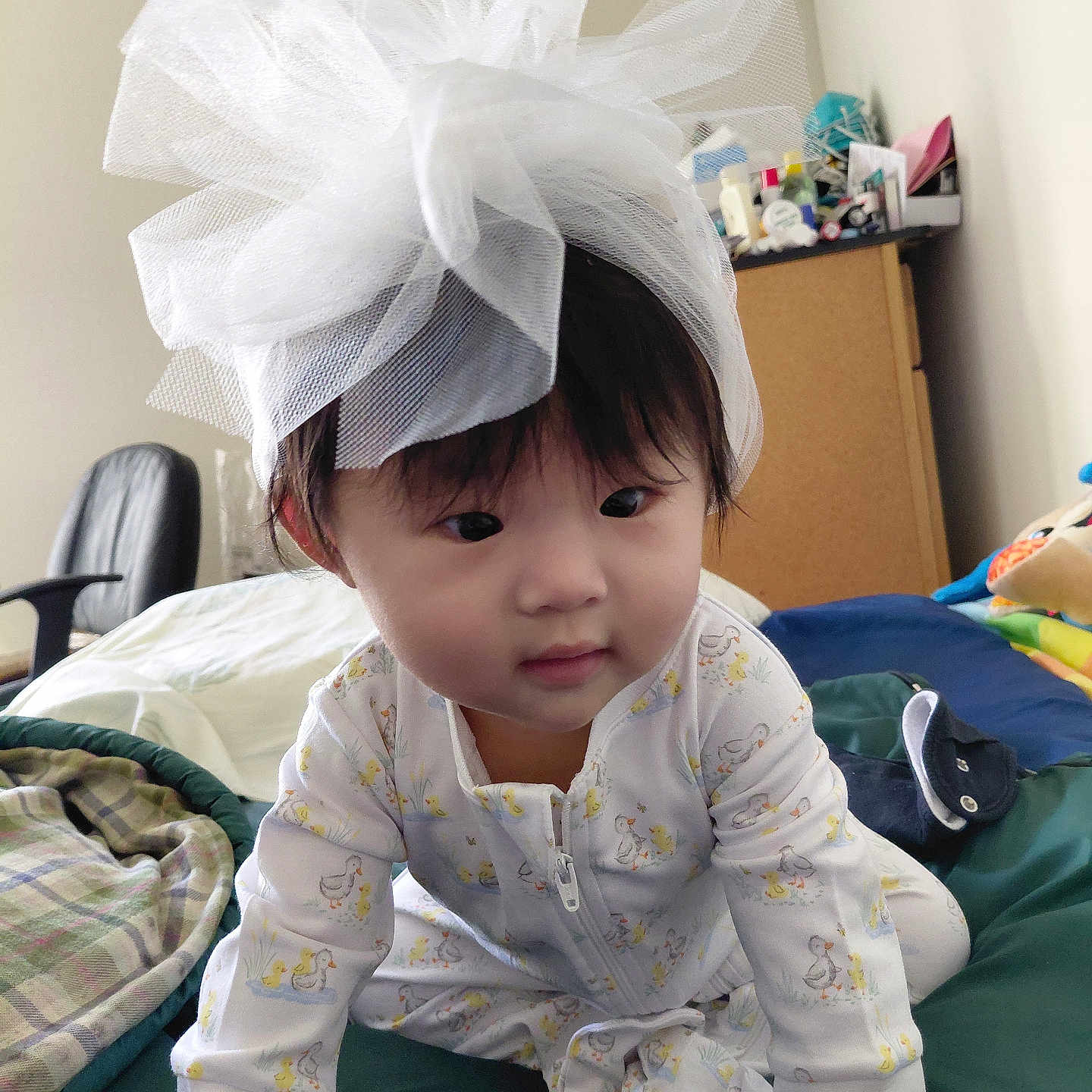 Jeanie joined the competition — help win amazing prizes! baby, child, tulle, headwear, blanket, bed, crawling, cute, indoors, clothing, pajamas, infant, face, expression, furniture, room, soft, comfort, playful, adorable